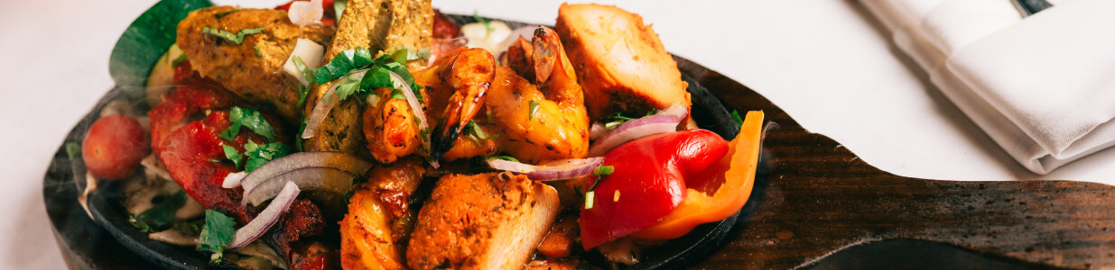 Moghel Tandoori Cover Image